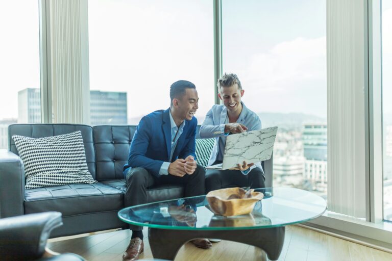 Wealth management advisors discussing investment strategy with affluent clients