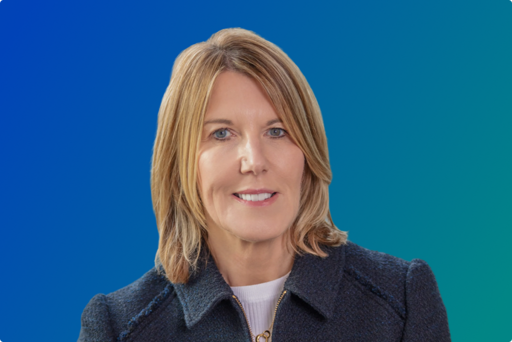 Woman executive head-and-shoulders against a blue background