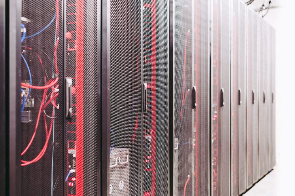 Enclosed server racks in a data center, an illustrative computing infrastructure scene