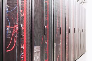 Enclosed server racks in a data center, an illustrative computing infrastructure scene
