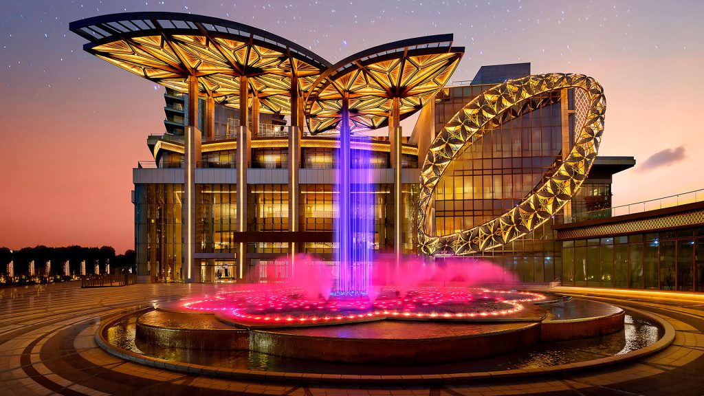 Illuminated fountain and architecture at Jio World Centre in Mumbai