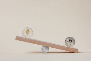 Minimalist image of Ethereum and Bitcoin coins balancing on a plank, symbolizing crypto market dynamics