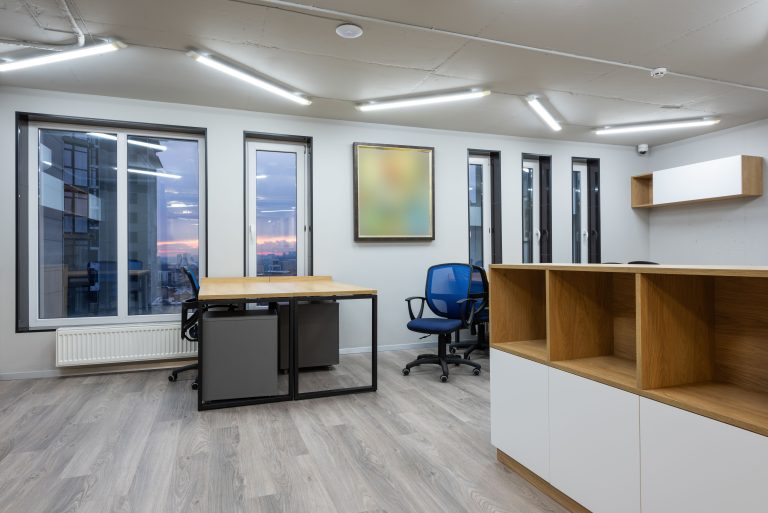 Stock photo of an empty modern office with desks and chairs