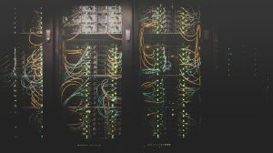Network server cabinets with illuminated cables behind mesh doors